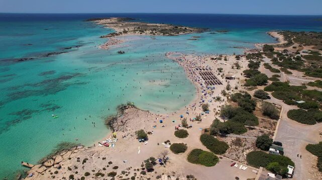 Aerial video of the famous  Elafonisi beach with the turquoise waters and  the pink sand ,in chania, Crete, Greece.