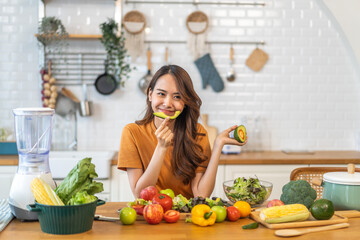 Portrait of beauty health asian woman having fun hold avocado cooking, vegan food healthy eat, fresh vegetable, cholesterol, vitamins, HDL, vegetarian in kitchen.Diet.Fitness, healthy food