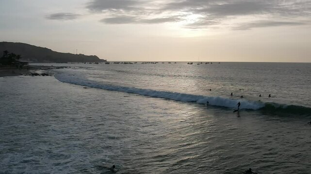Aerial video above the coastline in the coastal town of Mancora Peru