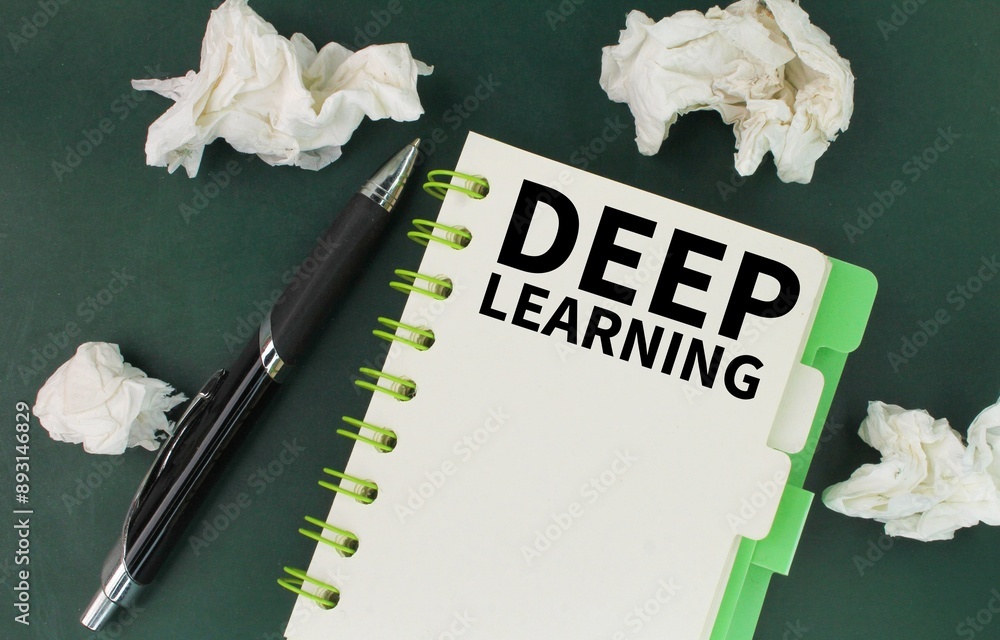 Poster pen, wad of paper and a book with the word deep learning. concept to understand something correctly.