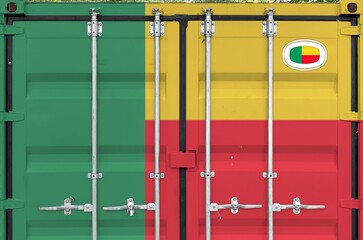Benin flag depicted on metal doors of shipping cargo container outdoors in docks area close up