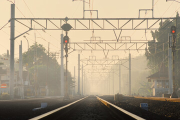 Railway cross in Maguwo train station is closely watched due to limited visibility during foggy...