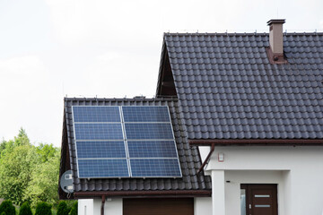 Fototapeta premium Installing a Solar Cell on a Roof.