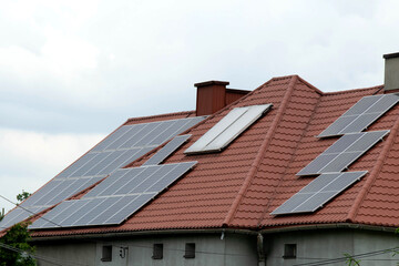 Installing a Solar Cell on a Roof.