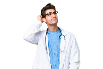 Young doctor man over isolated background having doubts and with confuse face expression