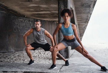 Couple, stretching and exercise outdoor for fitness, wellness and accountability as relationship...