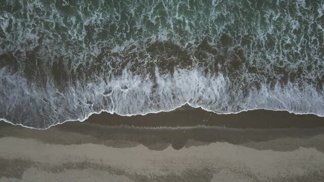 Aerial video above the coastline in the coastal town of Mancora Peru