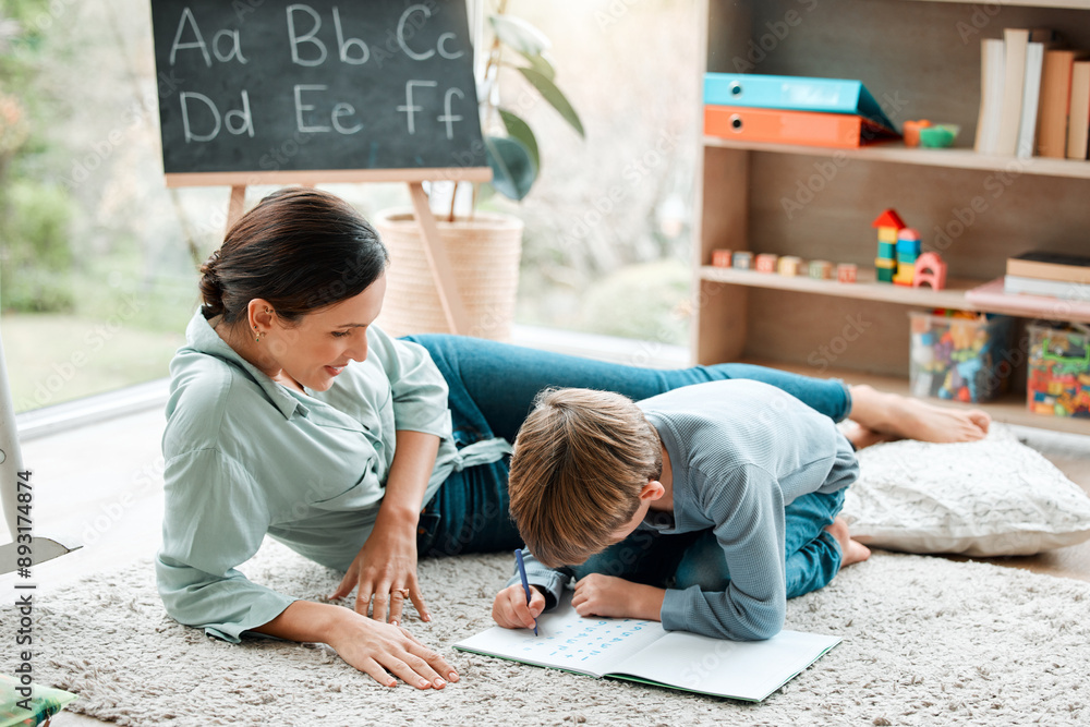 Wall mural Woman, child and writing in book on floor with math activity, education and bonding for learning addition of study. Mother, boy and drawing answer for assessment, homework and development at house