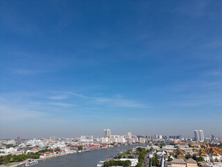 Fototapeta premium Aerial view Wat Arun Ratchawaram in morning with curve of chao phraya river sunset light