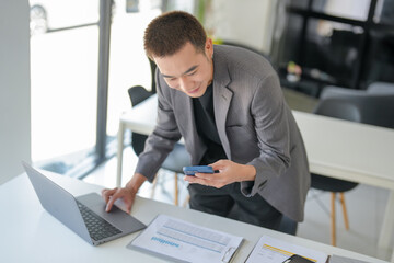 Business people holding Smartphone working mobile devices. cell telephone technology e-commerce concept.