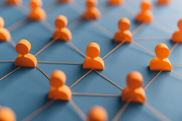 Interconnected orange figures representing a network of individuals on a blue background. Concept of communication, teamwork, and community.