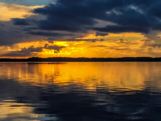 Twilight Tranquility: The final moments of a Finnish sunset create a stunning silhouette against a vibrant, color-streaked sky.