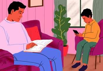 Father reading book on couch by son using tablet PC in living room