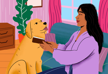 Smiling young woman brushing Golden Retriever at home