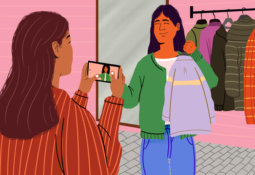 Fashion influencer filming vlog through smart phone in clothes boutique