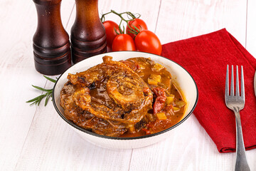 Italian cuisine - ossobuco with sauce