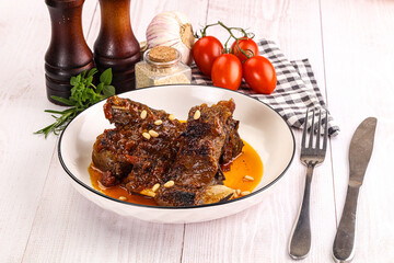 Prepared tasty beef ribs with sauce