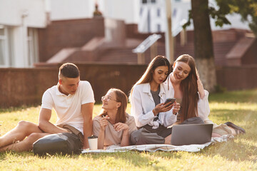 Preparation, sitting and learning. Group of students are outside together