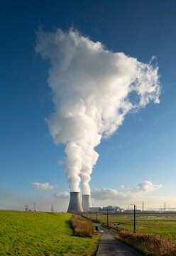 Nuclear power station with two steaming cooling towers in Belgium