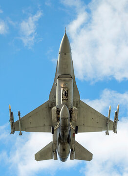 F-16 fighter bomber under cloudy sky in Netherlands