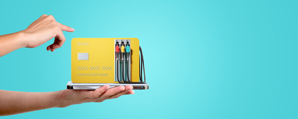 Woman finger touch credit card, fuel hose gas station and smartphone