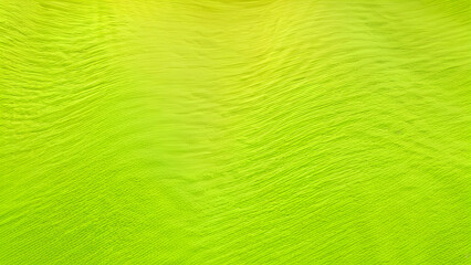 Abstract yellow lime green fabric background, color gradient ombre geometric lines stripes waves drapery noise grain grunge rough bright neon shades light glow shine