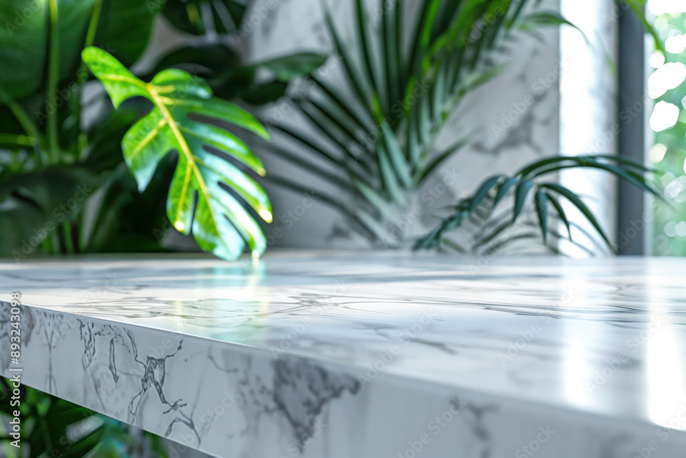 Poster empty marble tabletop for product placement with a blurred background of lush green plants
