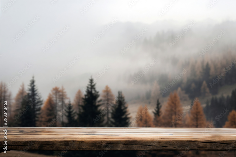 Poster empty wooden table is displaying a foggy autumn forest landscape with evergreen and larch trees