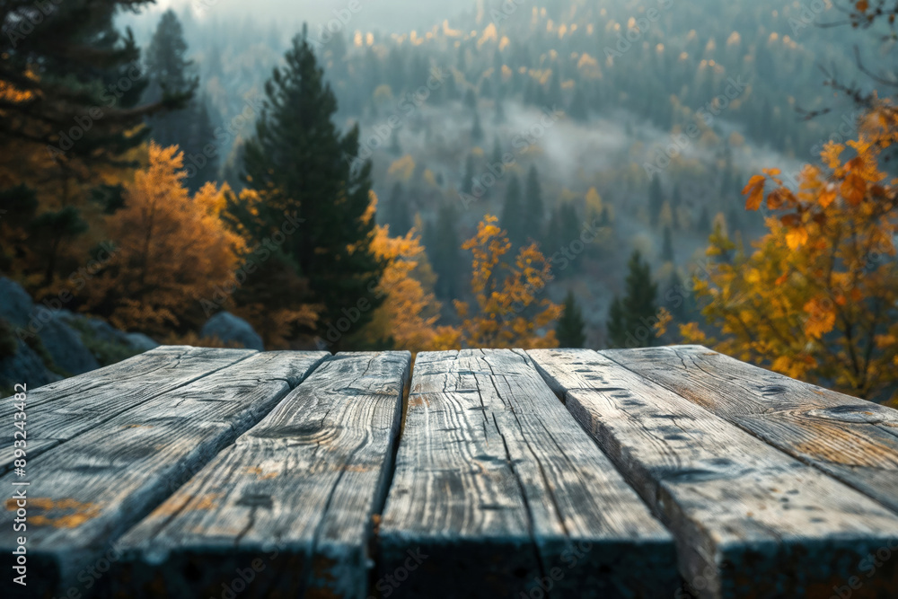 Poster empty wooden table displaying misty autumn forest landscape