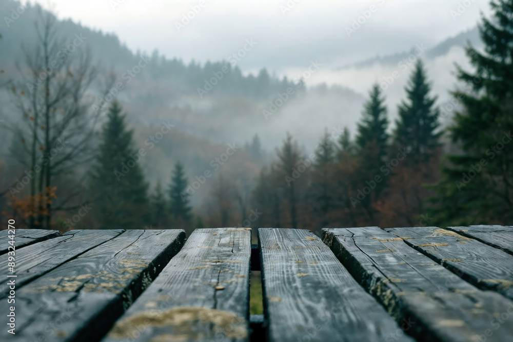 Poster Empty wooden table top with a misty forest background providing copy space for your product placement