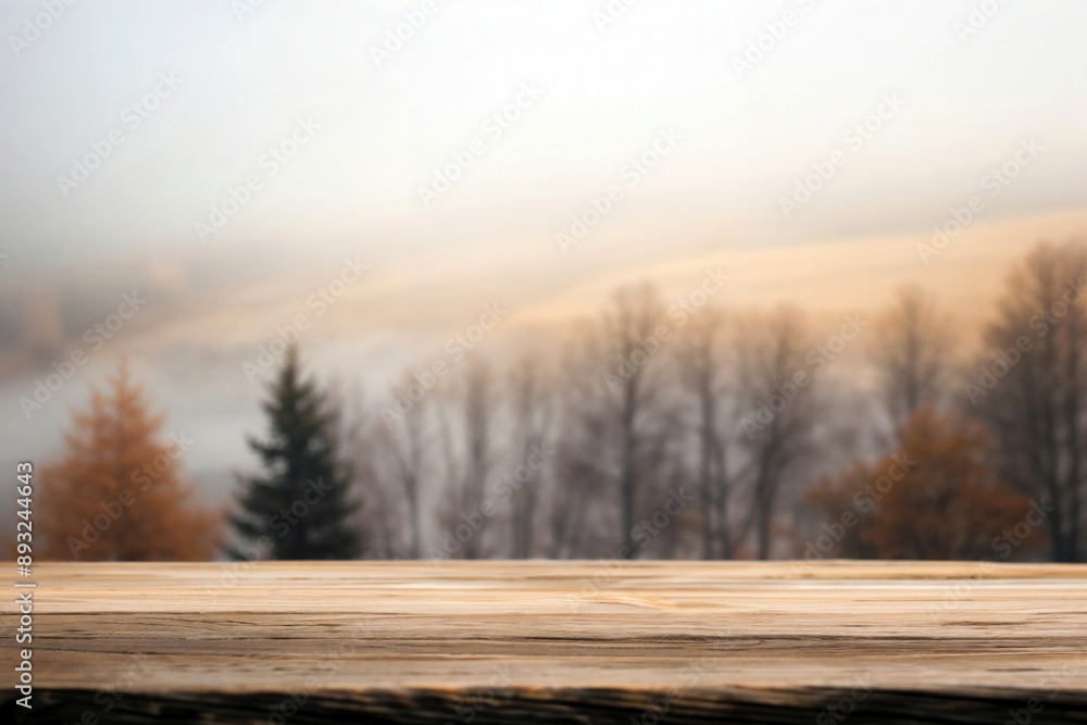 Aufkleber wooden tabletop providing space for product placement against a backdrop of a misty autumn mountain 
