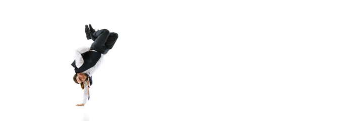 Banner. Young man dressed formalwear demonstrate dance moves against white studio background with negative space. Concept of business, modern work culture, success, start-up, fashion and style. Ad