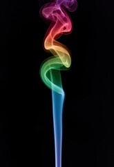 Obraz premium Colorful smoke swirls against a dark background