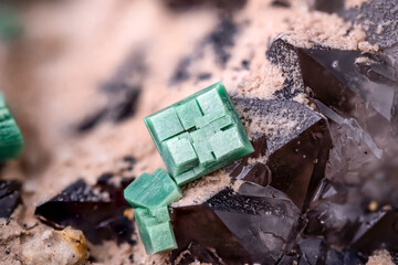 green Metatorbernite on quartz, macro photography detail texture. Specimen from Margabal Mine, Entraygues-sur-Truyère, Aveyron, Occitanie, France. close-up polished semi-precious gemstone.