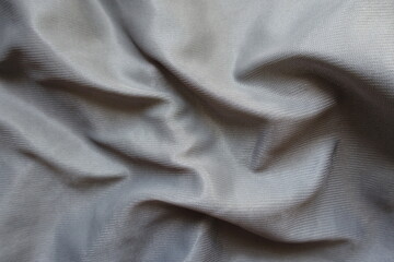 Soft folds on simple unprinted grey polyamide fabric