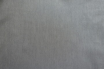 Texture of light gray polyester fabric with herringbone pattern