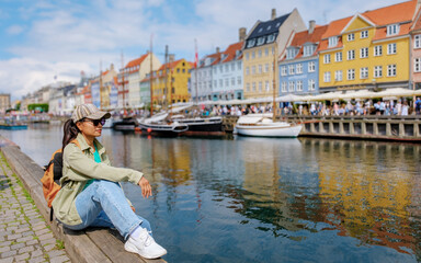 Copenhagen Daydream: A Moment of Peace by the Harbor