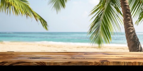 Beautiful tropical beach scene with a palm tree and wooden table overlooking the serene ocean.
