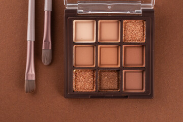 Natural colored eye shadow makeup palette with brush. Woman cosmetic and beauty product, eige color eyeshade pattern