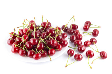 Ripe red cherries on plate isolated on white background
