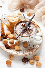 Hot cocoa drink with cookies, sugar and cinnamon