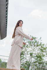 Portrait of a young caucasian girl smiling and enjoying life on the roof.