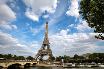 Fototapeta premium The Eiffel Tower by the Seine River and Pont d'Iéna on a Summer Day - Paris, France