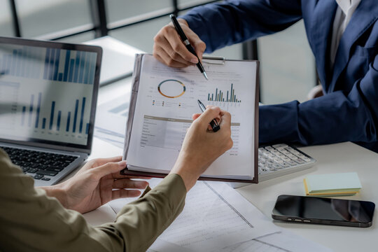 Businesspeople analyze investment on marketing data, Teamwork discussing in meeting