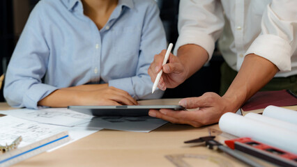 Engineer or interior Architects designer construction plans on blueprint