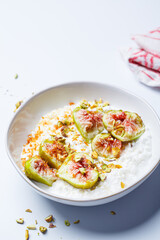 Breakfast cottage cheese with figs and maple syrup.