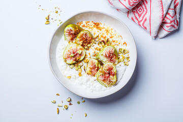 Breakfast cottage cheese with figs and maple syrup.