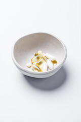 Capsules and tablets of vitamins. Health and beauty concept.