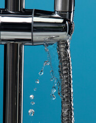 Bidet shower head leak water from hoses plumbing in bathroom as water clogged drop. Blue Bathroom...