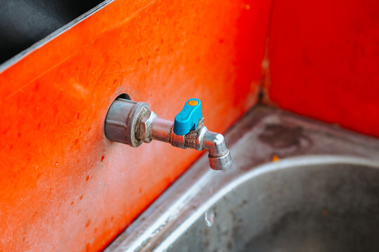 the water tap in the sink is outdated